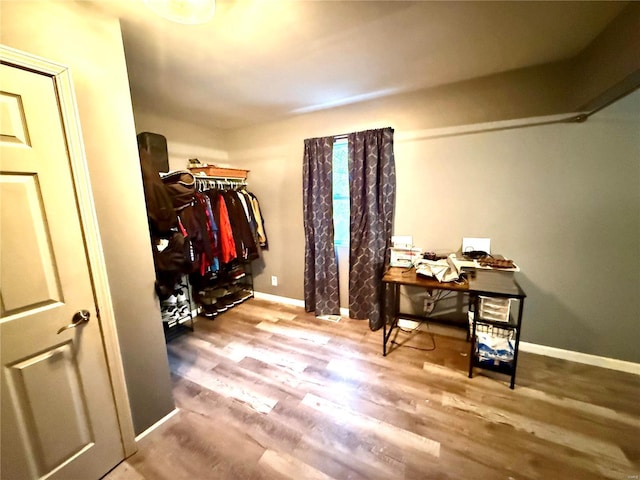 spacious closet featuring hardwood / wood-style flooring