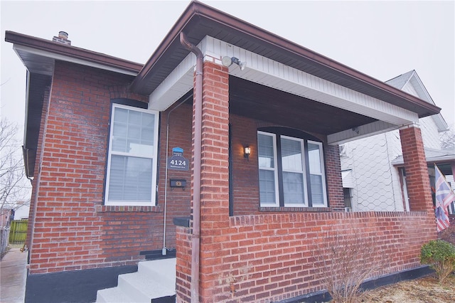 view of side of home featuring brick siding