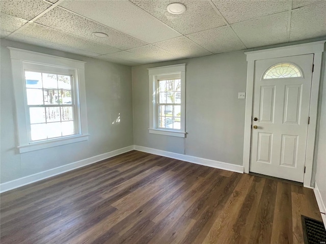 entryway with baseboards, dark wood-style floors, and visible vents