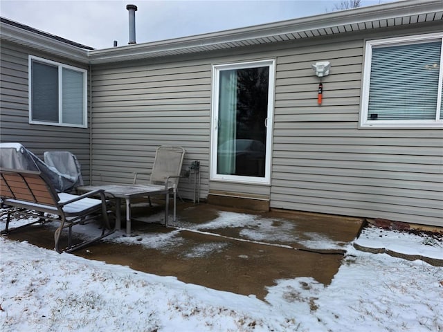 view of snow covered patio