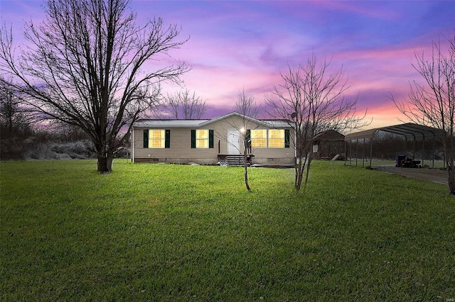 manufactured / mobile home with a carport, entry steps, crawl space, and a lawn