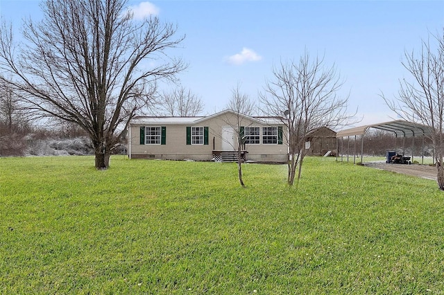 manufactured / mobile home with a carport, a front yard, crawl space, and entry steps