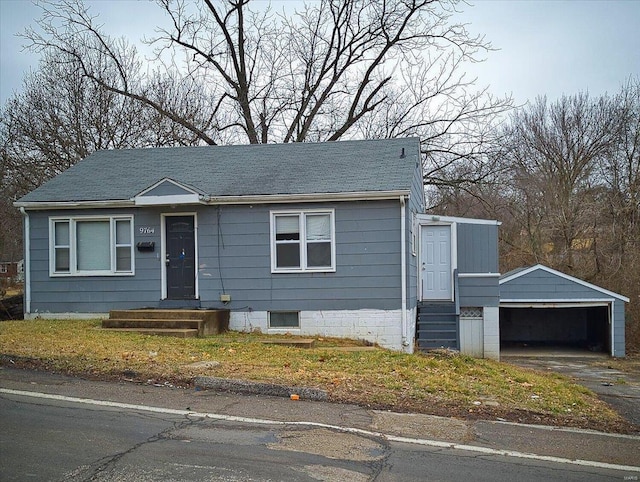 view of front of home with an outbuilding and a garage