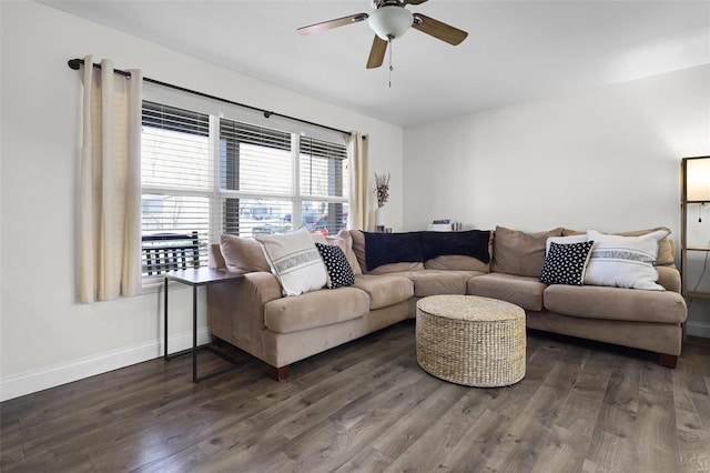 living area with wood finished floors, baseboards, and ceiling fan