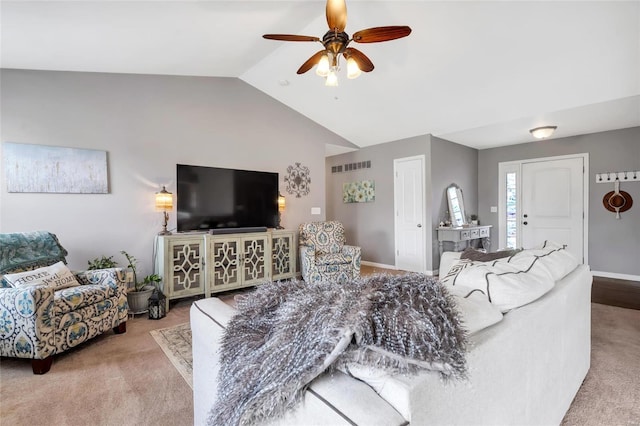 living area featuring visible vents, carpet floors, ceiling fan, and vaulted ceiling