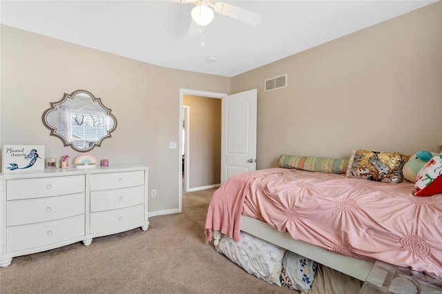 bedroom featuring ceiling fan, baseboards, visible vents, and light carpet