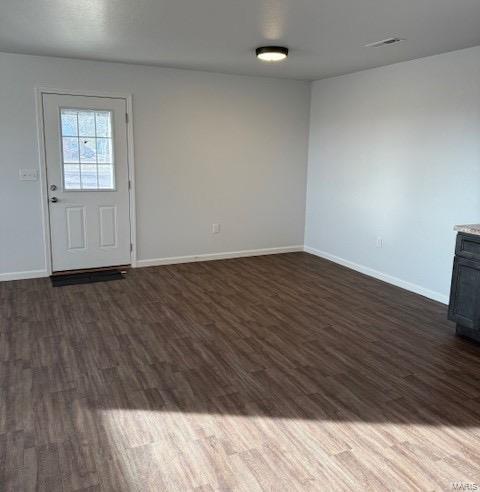 interior space with dark wood-type flooring