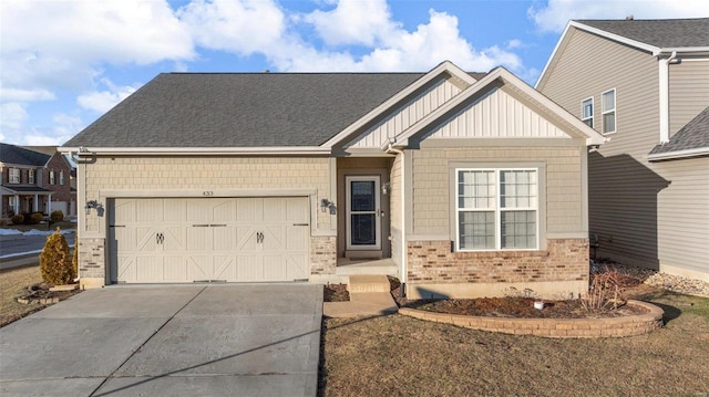 view of front of home with brick siding, roof with shingles, concrete driveway, board and batten siding, and a garage