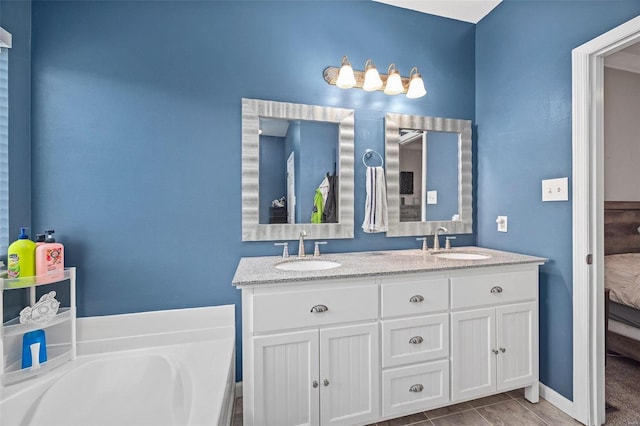 ensuite bathroom featuring a bathtub, a sink, ensuite bath, and double vanity