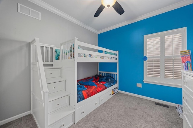 bedroom with light carpet, ornamental molding, visible vents, and baseboards