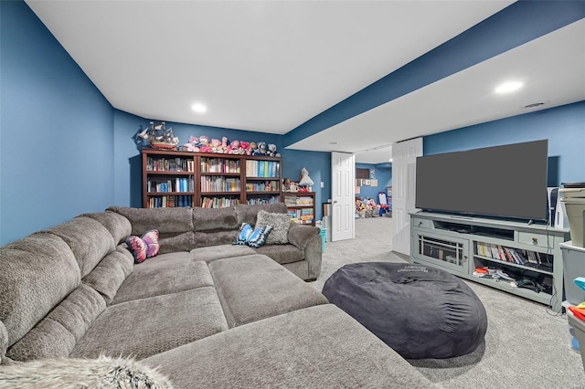 living room with light carpet and recessed lighting