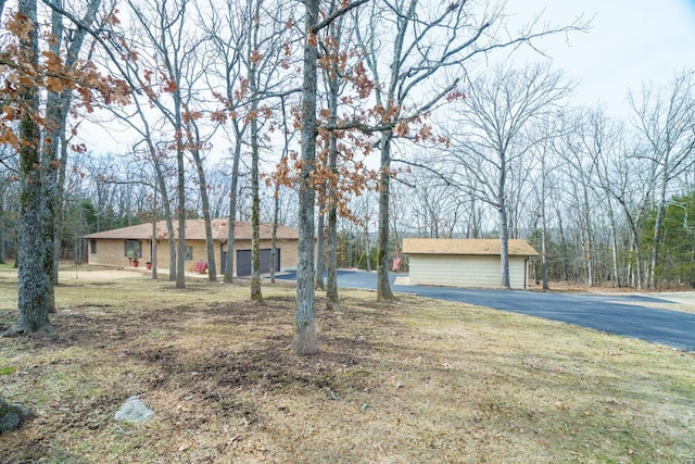 ranch-style house with a front lawn