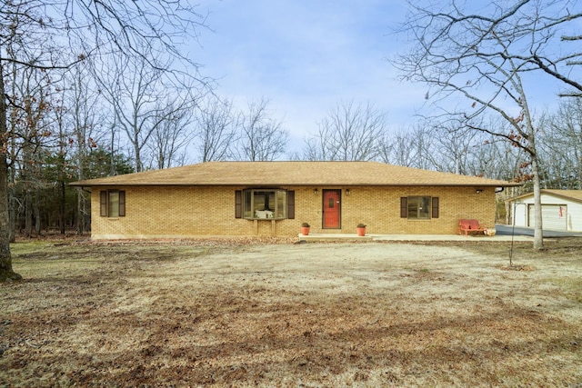 single story home with an outbuilding and a garage