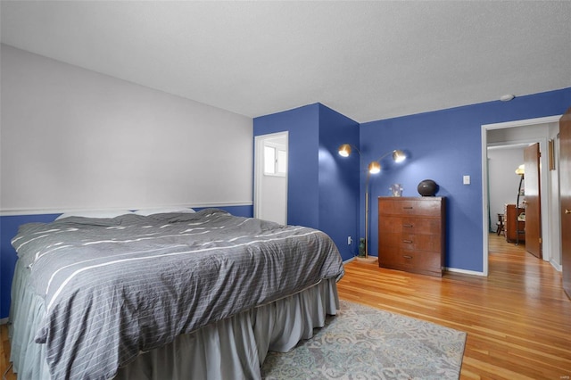 bedroom with wood finished floors