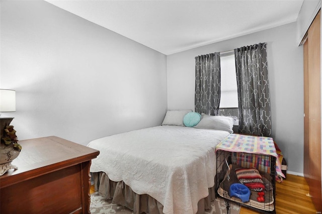 bedroom with wood finished floors