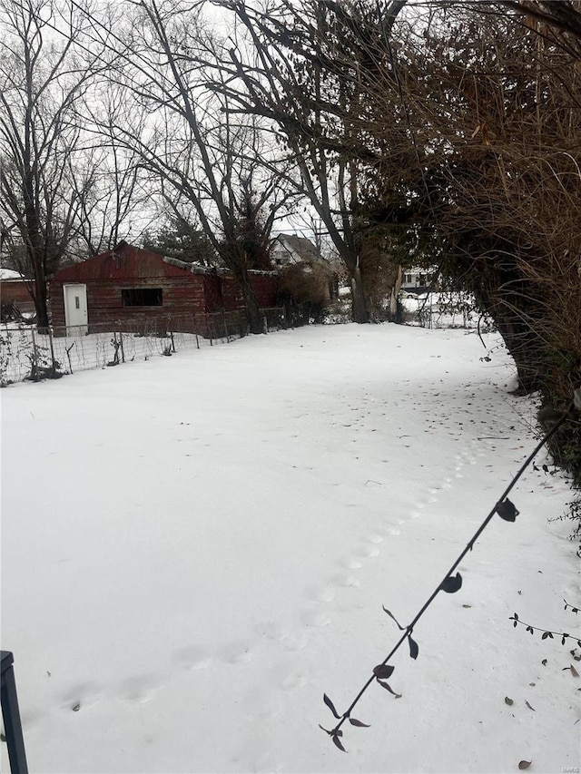 view of yard layered in snow