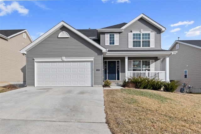 traditional-style home featuring a garage, concrete driveway, a porch, and a front lawn