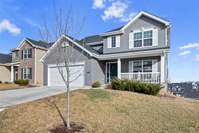 traditional home featuring covered porch, concrete driveway, an attached garage, and a front yard