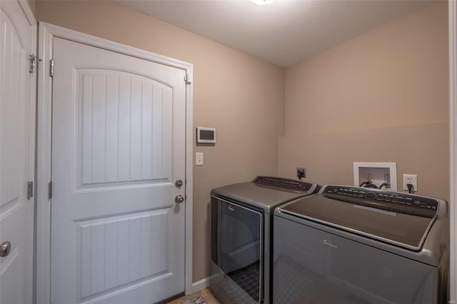 clothes washing area with independent washer and dryer