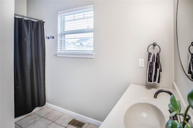 bathroom with vanity and tile patterned floors