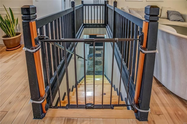 stairway featuring wood-type flooring