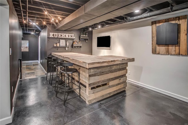 bar featuring butcher block countertops