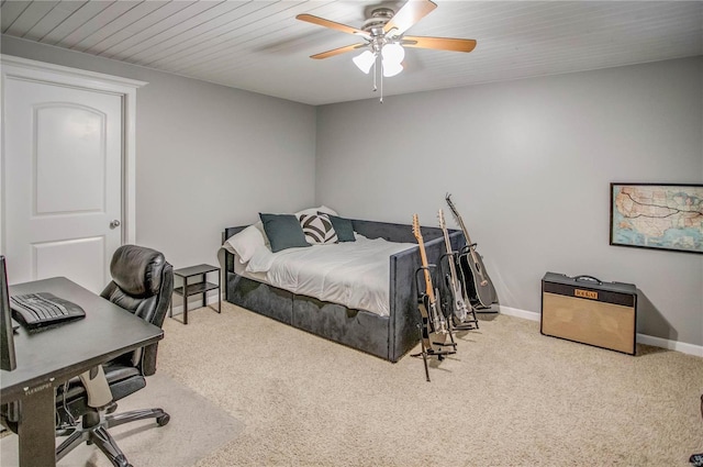 bedroom with wooden ceiling, light colored carpet, and ceiling fan