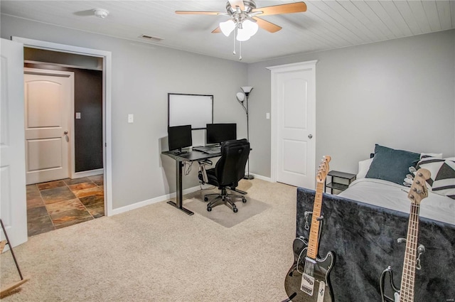 carpeted home office with ceiling fan