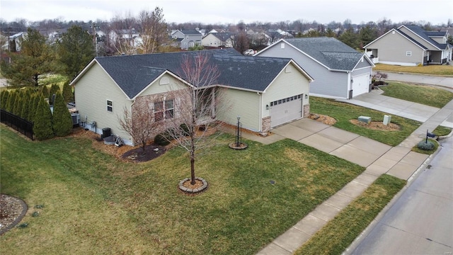 view of front facade with a front lawn and a garage