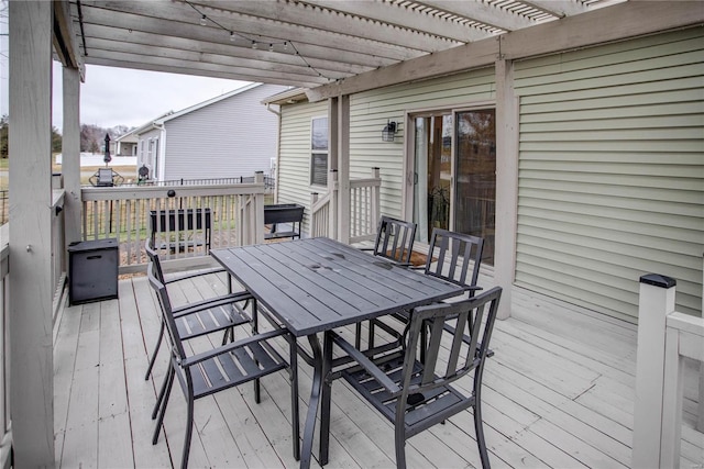 wooden terrace with a pergola