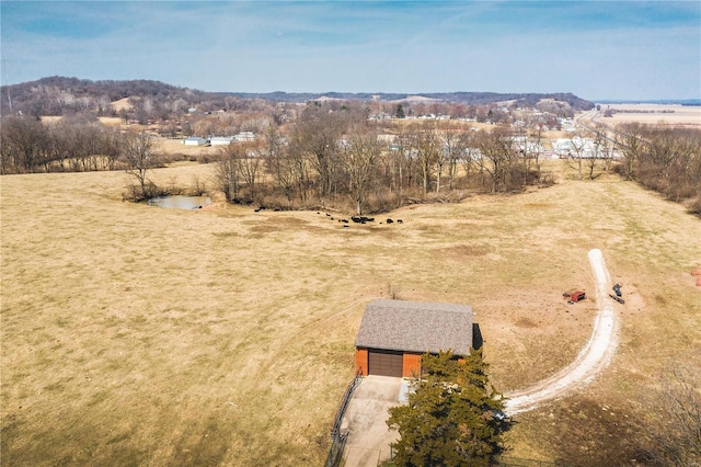 birds eye view of property featuring a rural view