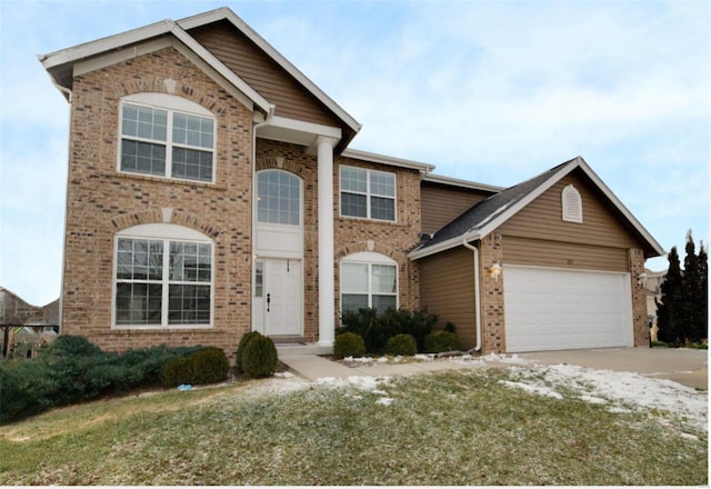 view of front of house featuring a front lawn and a garage