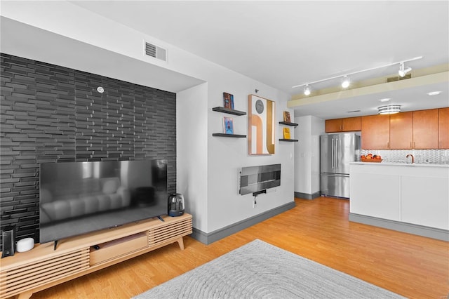 living room with light hardwood / wood-style flooring