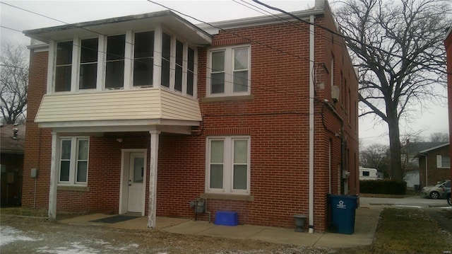 view of front of house with a sunroom