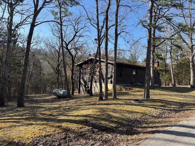 view of side of property with faux log siding