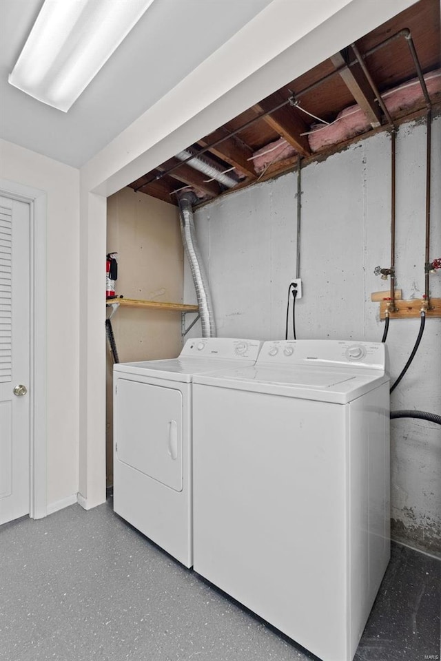 laundry area with laundry area and washer and clothes dryer