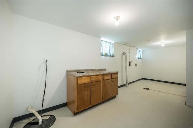 laundry room featuring baseboards