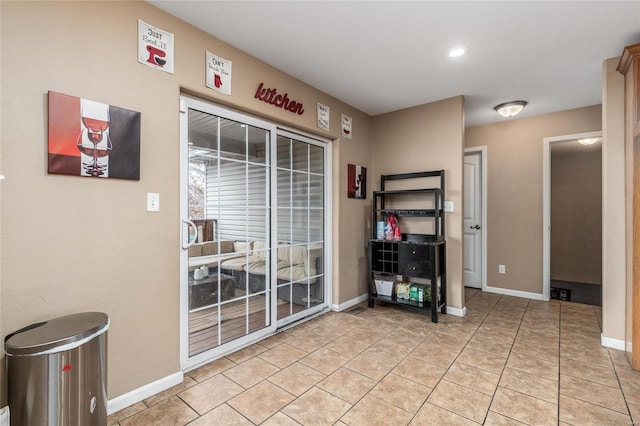 entryway with light tile patterned flooring