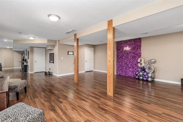 basement featuring dark hardwood / wood-style floors