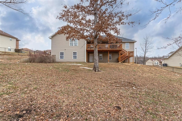 back of house with a wooden deck