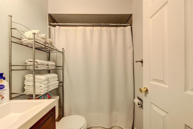 full bathroom with a shower with curtain and toilet