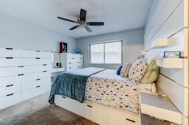 carpeted bedroom featuring ceiling fan and a textured ceiling