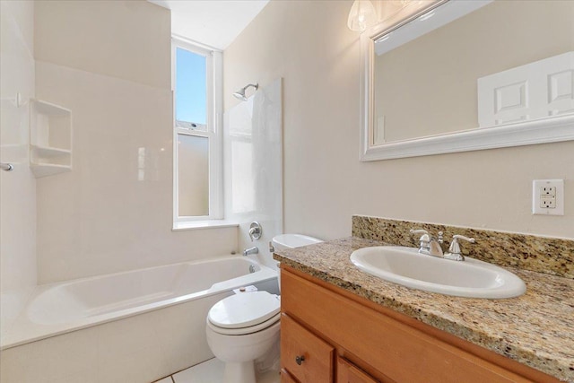 bathroom with toilet, shower / bathing tub combination, and vanity