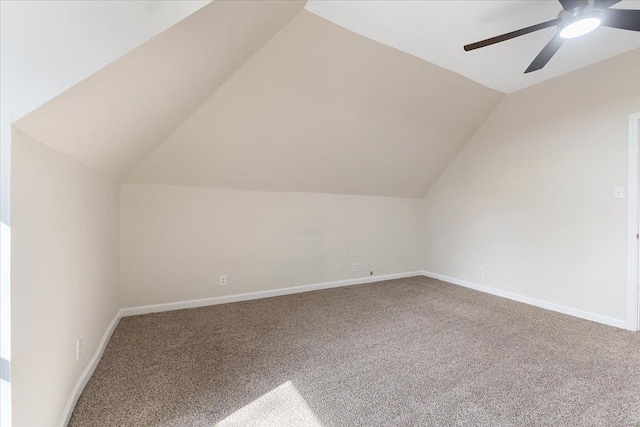 bonus room featuring lofted ceiling, ceiling fan, carpet flooring, and baseboards