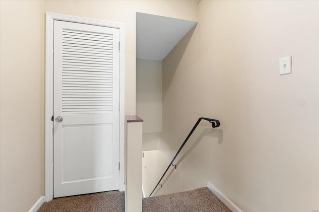 staircase with carpet and baseboards