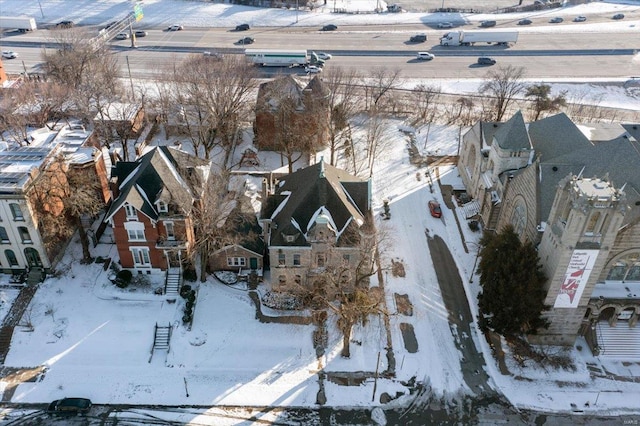 snowy aerial view featuring a residential view