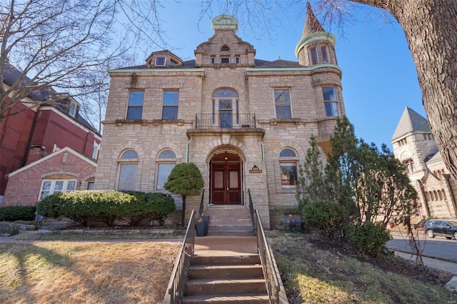 view of front of house featuring a balcony