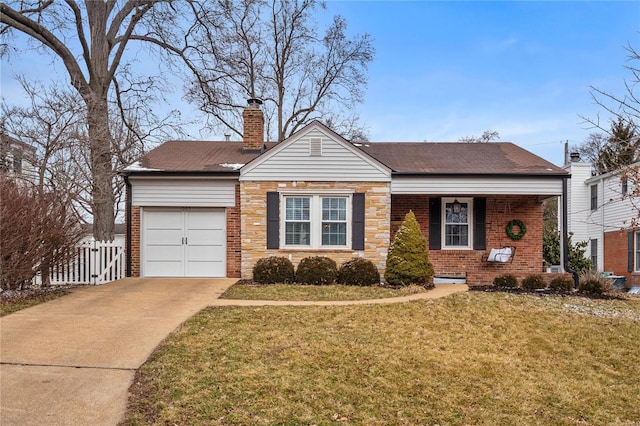 view of front facade with a garage and a front yard