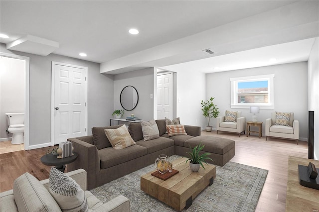 living room with light hardwood / wood-style floors