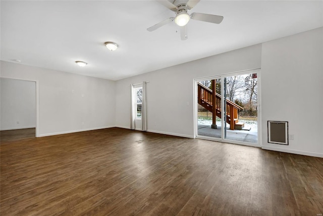 spare room featuring dark hardwood / wood-style floors and ceiling fan